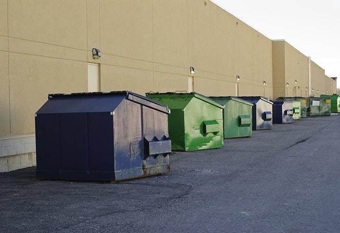 big yellow dumpsters on a construction lot in Calimesa CA